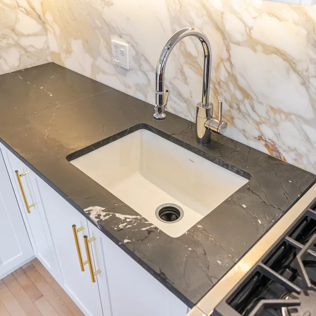 Honed granite & calacatta marble